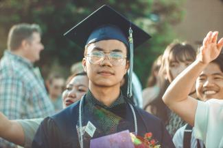 Man in a graduation cap and gown